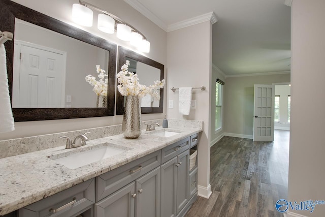 1908 Spanish Oaks Dr SE, Huntsville, AL 35803 - bathroom featuring crown molding, wood finished floors, and double vanity