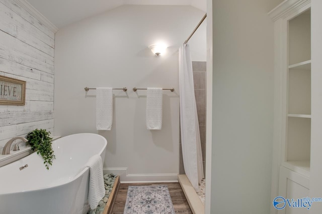 1908 Spanish Oaks Dr SE, Huntsville, AL 35803 - bathroom with wooden walls, wood finished floors, a shower with shower curtain, a freestanding bath, and vaulted ceiling