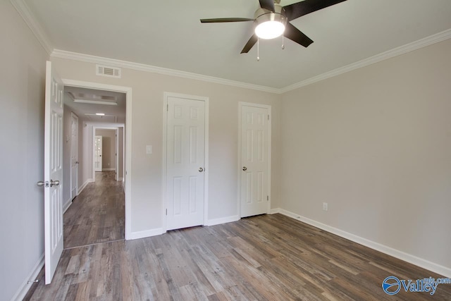 1908 Spanish Oaks Dr SE, Huntsville, AL 35803 - unfurnished bedroom with wood finished floors, ornamental molding, and a ceiling fan