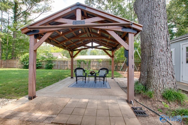 1908 Spanish Oaks Dr SE, Huntsville, AL 35803 - fenced backyard with a gazebo and a patio