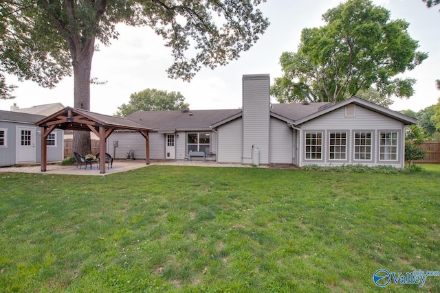 1908 Spanish Oaks Dr SE, Huntsville, AL 35803 - rear view of property featuring a gazebo, a patio area, and a chimney
