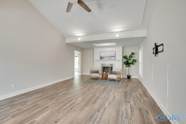 1908 Spanish Oaks Dr SE, Huntsville, AL 35803 - sitting room with a fireplace, wood finished floors, ceiling fan, and beamed ceiling