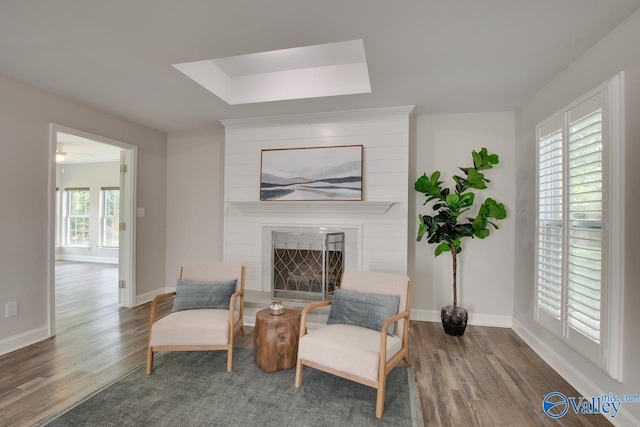 1908 Spanish Oaks Dr SE, Huntsville, AL 35803 - living area with wood finished floors, a fireplace, and ceiling fan