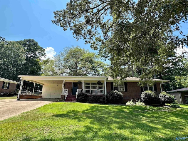 ranch-style house with covered porch, a front lawn, and a carport