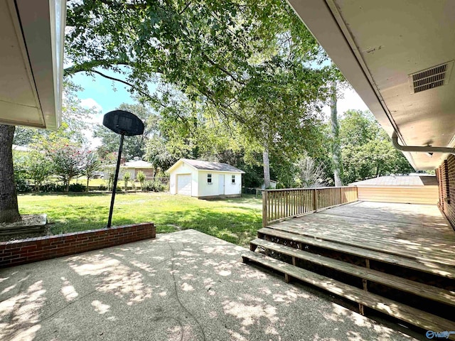 view of patio / terrace with an outbuilding and a wooden deck