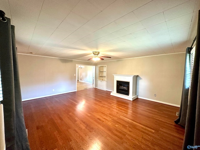 unfurnished living room with ceiling fan and hardwood / wood-style flooring