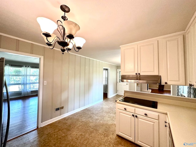 kitchen with white cabinetry, crown molding, light wood-type flooring, and a chandelier