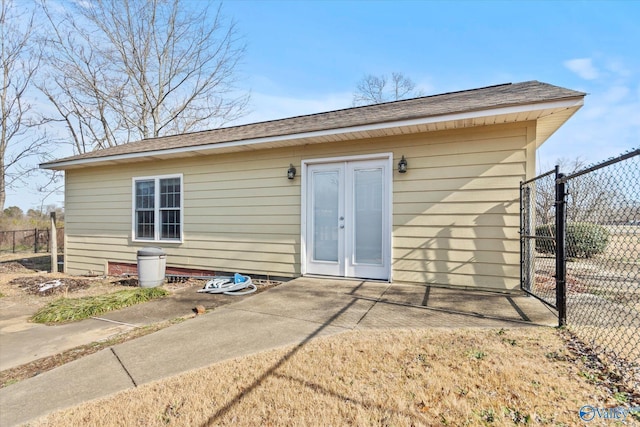 rear view of house featuring a patio area and french doors