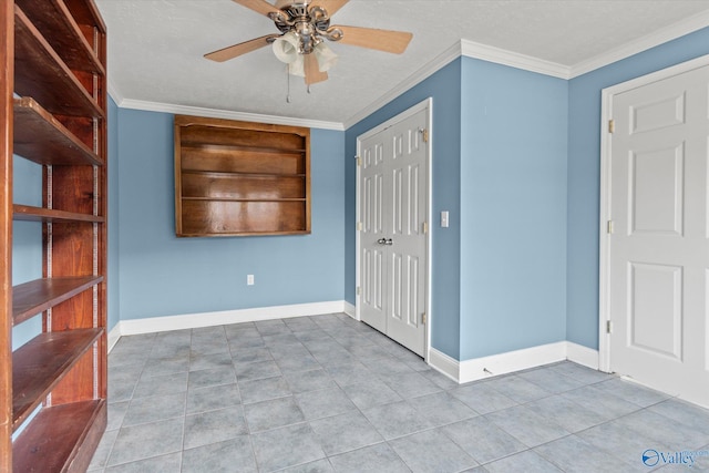 empty room with ceiling fan and ornamental molding