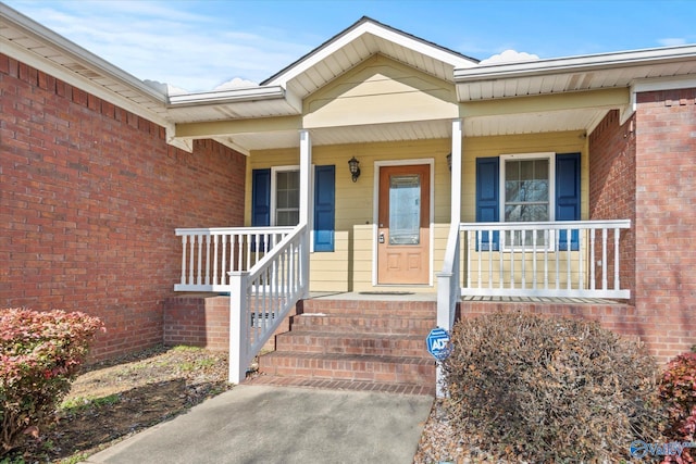 entrance to property featuring a porch