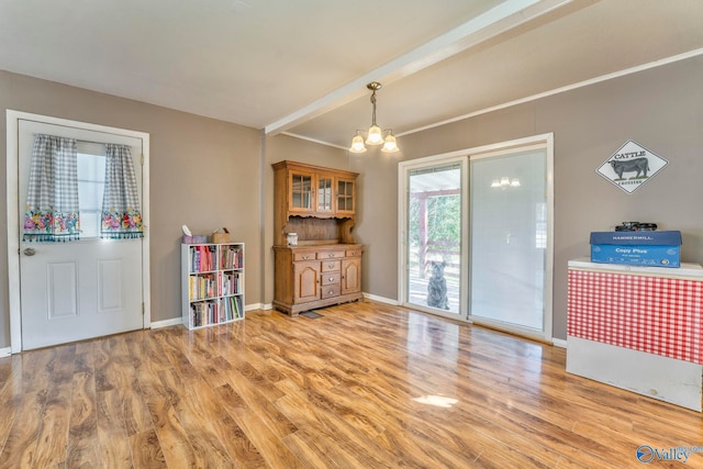 interior space with light wood-type flooring, baseboards, a chandelier, and beamed ceiling