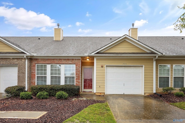 single story home featuring a garage