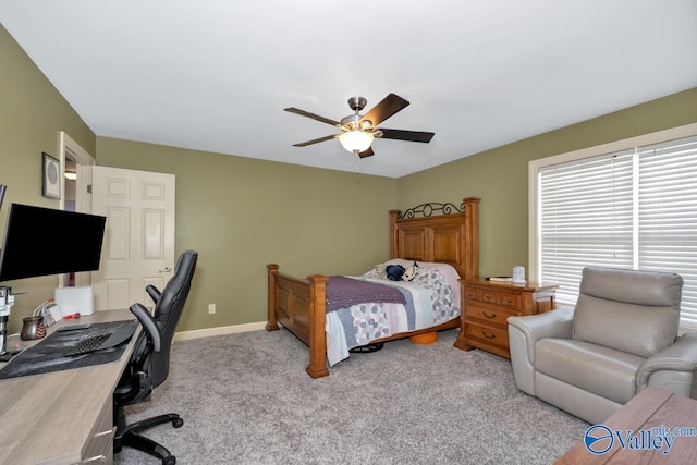 bedroom featuring a ceiling fan, baseboards, and carpet