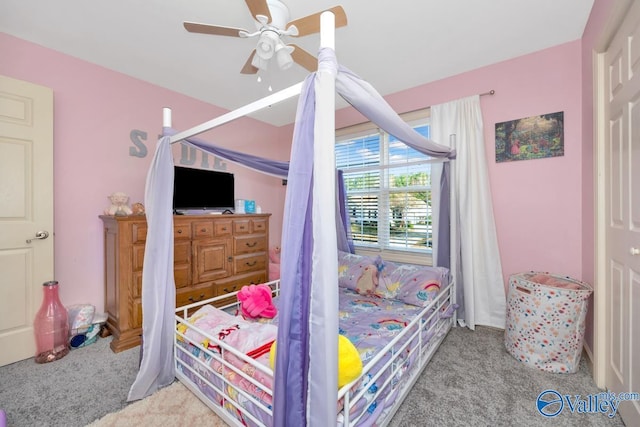 bedroom with ceiling fan and carpet flooring