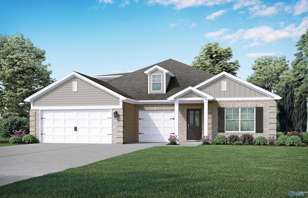 view of front of house featuring a garage and a front lawn