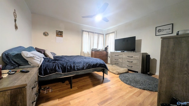 bedroom featuring ceiling fan and light hardwood / wood-style floors