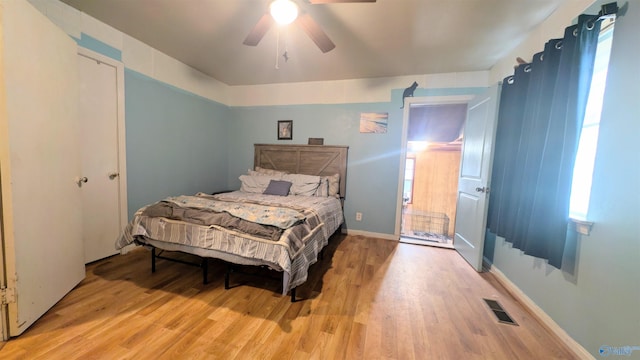 bedroom with ceiling fan and light hardwood / wood-style floors