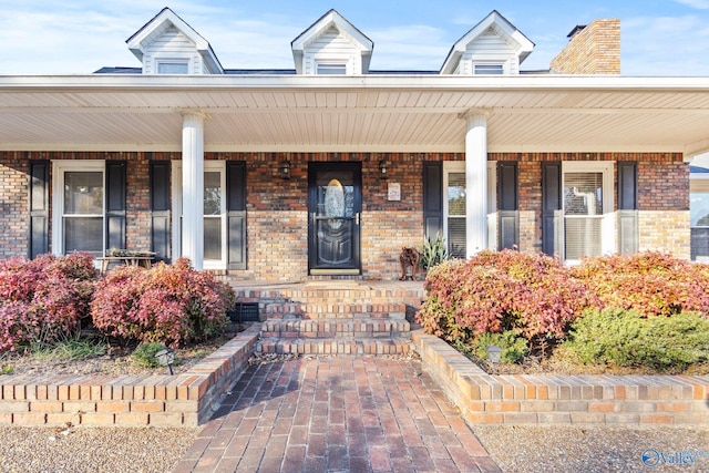 doorway to property with covered porch