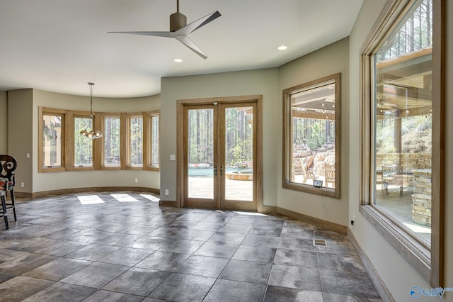 doorway to outside with recessed lighting, french doors, baseboards, and ceiling fan with notable chandelier