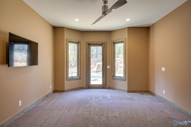 unfurnished room featuring baseboards, carpet, a ceiling fan, and recessed lighting