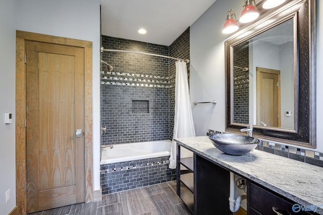 bathroom featuring tile patterned flooring, shower / bath combination with curtain, and vanity