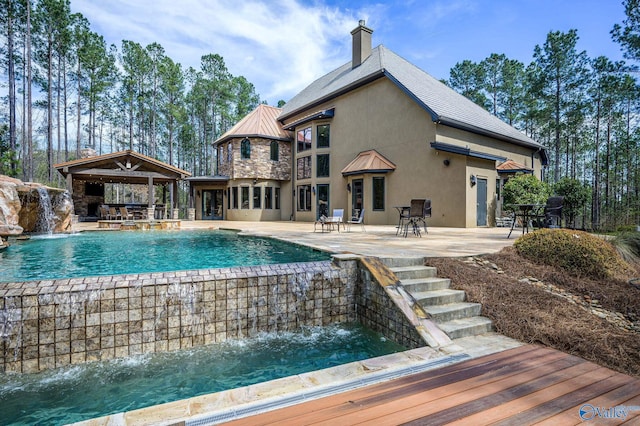 view of pool featuring a patio and pool water feature