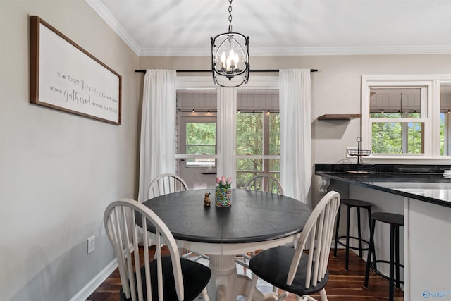 471 Oak Trl NE, Hartselle, AL 35640 - dining area featuring a chandelier, ornamental molding, dark wood-style flooring, and baseboards