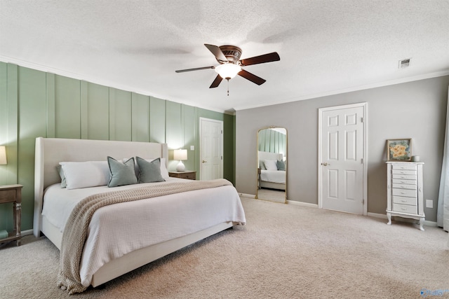 471 Oak Trl NE, Hartselle, AL 35640 - bedroom with crown molding, carpet flooring, ceiling fan, arched walkways, and a textured ceiling