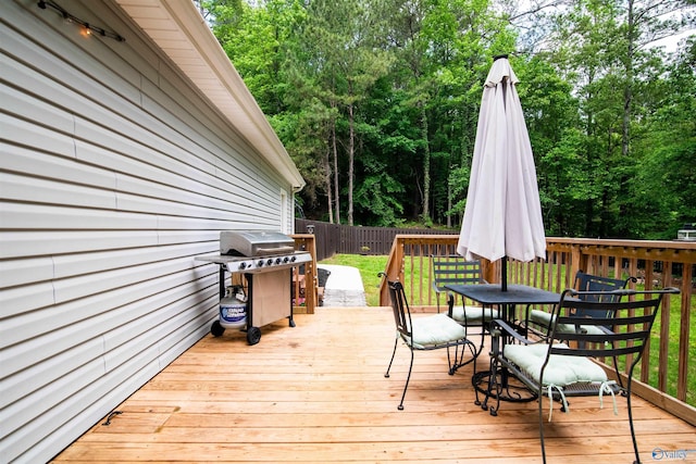 471 Oak Trl NE, Hartselle, AL 35640 - deck with outdoor dining area, area for grilling, and fence