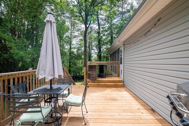 471 Oak Trl NE, Hartselle, AL 35640 - deck with outdoor dining space and view of scattered trees