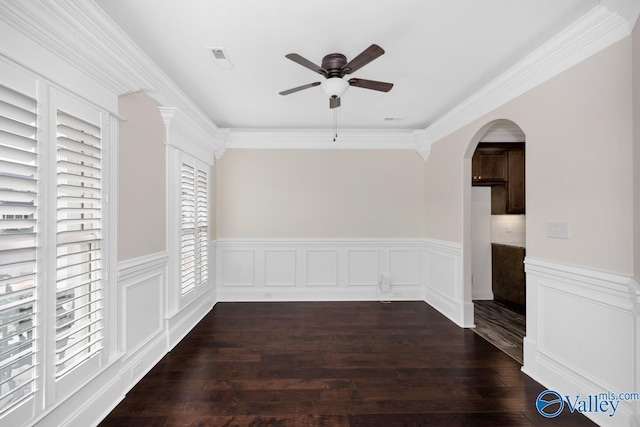 unfurnished room with ceiling fan, ornamental molding, and dark hardwood / wood-style flooring