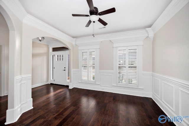 entrance foyer with crown molding, dark hardwood / wood-style floors, and ceiling fan