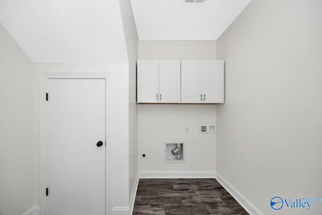 washroom with dark hardwood / wood-style floors, cabinets, hookup for an electric dryer, and hookup for a washing machine