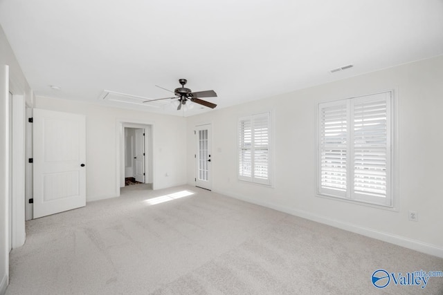 carpeted spare room with ceiling fan