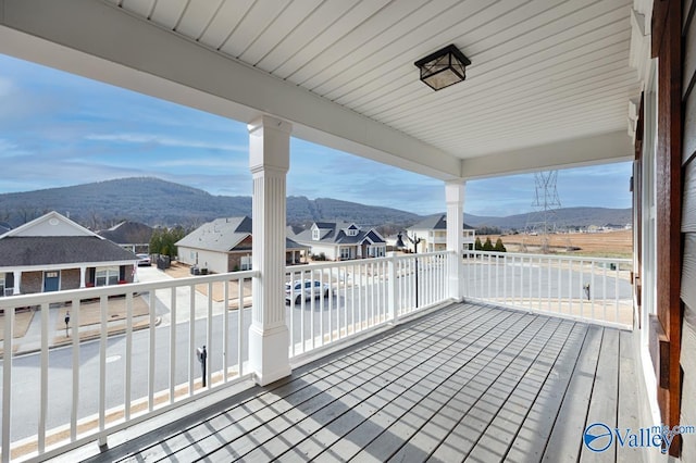 exterior space featuring a balcony and a mountain view