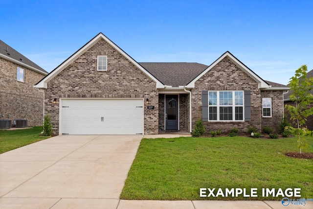2000 Austin Dr NE, Cullman, AL 35058 - view of front of property featuring brick siding, central AC unit, concrete driveway, and a front yard
