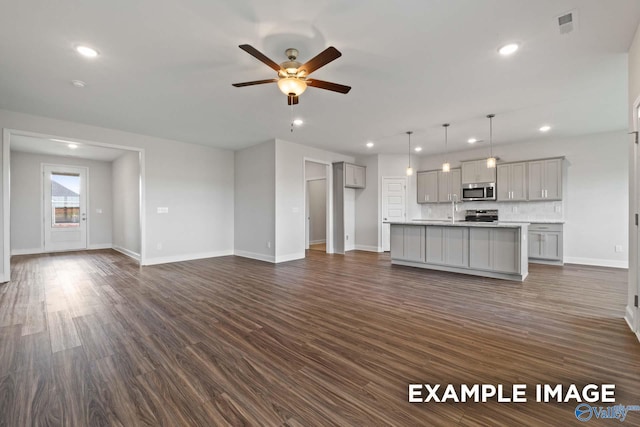 2000 Austin Dr NE, Cullman, AL 35058 - unfurnished living room featuring recessed lighting, dark wood-style flooring, and a ceiling fan