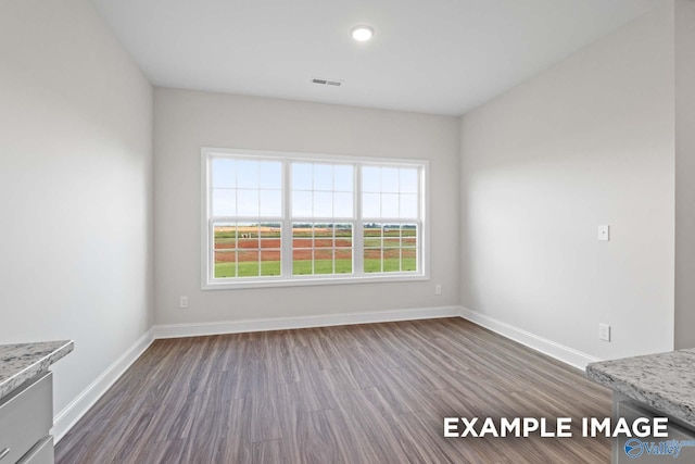 2000 Austin Dr NE, Cullman, AL 35058 - spare room featuring visible vents, baseboards, and dark wood-style flooring