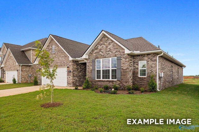 2000 Austin Dr NE, Cullman, AL 35058 - view of front facade with a front yard, an attached garage, brick siding, and driveway