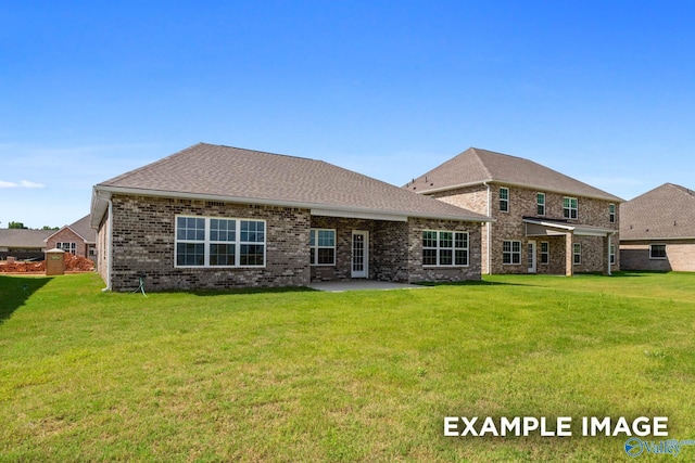 2000 Austin Dr NE, Cullman, AL 35058 - rear view of house featuring a yard, a patio area, brick siding, and a shingled roof