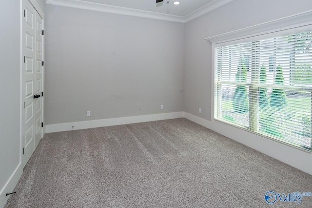 carpeted spare room with ceiling fan, ornamental molding, recessed lighting, and baseboards