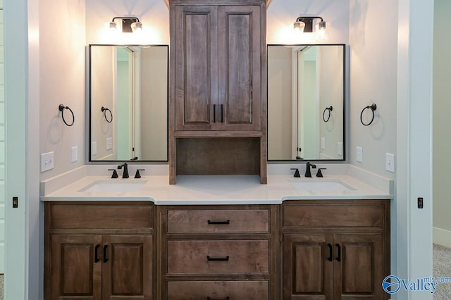 full bath with double vanity and a sink