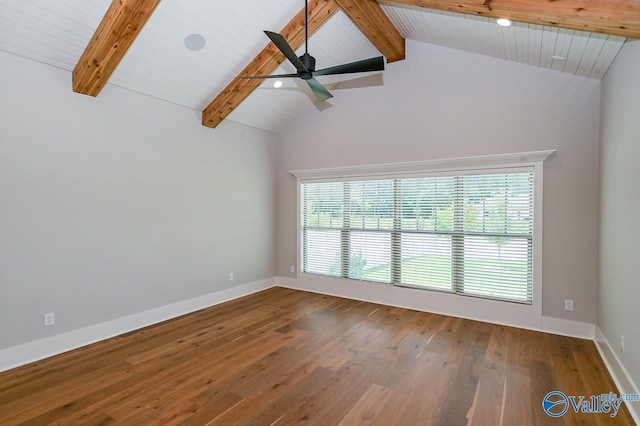 empty room with lofted ceiling with beams, baseboards, a ceiling fan, and wood finished floors