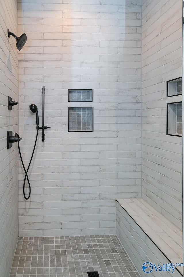 bathroom featuring tiled shower