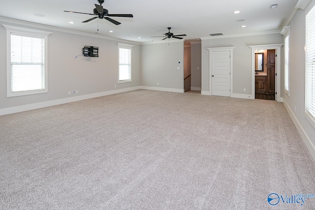 carpeted empty room featuring ornamental molding and ceiling fan