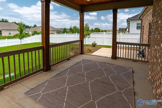 view of patio / terrace featuring a residential view and a fenced backyard