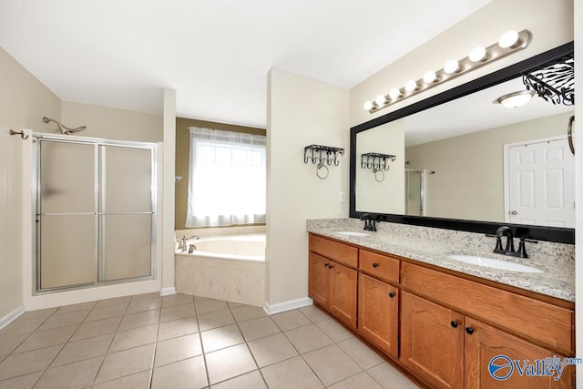 full bathroom with a garden tub, a sink, double vanity, and a stall shower