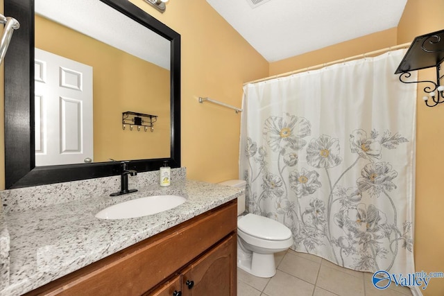 bathroom with vanity, toilet, tile patterned flooring, and curtained shower