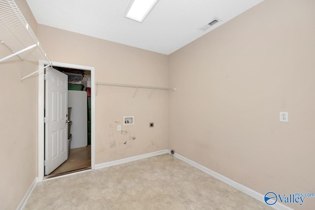 washroom with laundry area, visible vents, hookup for an electric dryer, hookup for a washing machine, and baseboards