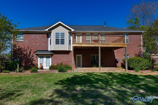 rear view of house featuring brick siding, a yard, french doors, and a deck